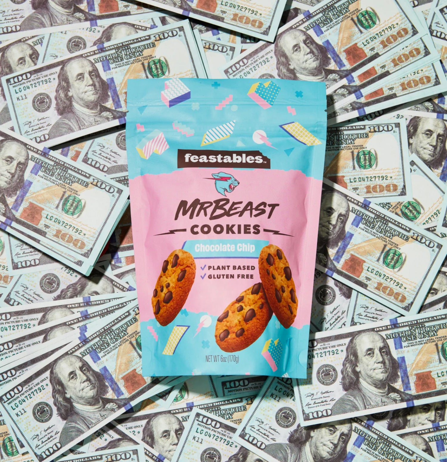 MrBeast Feastables cookies sit on top of a pile of $100 bills.