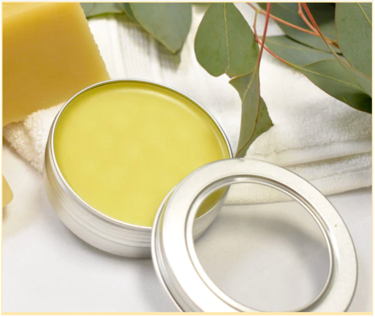 Open container of beeswax lip balm