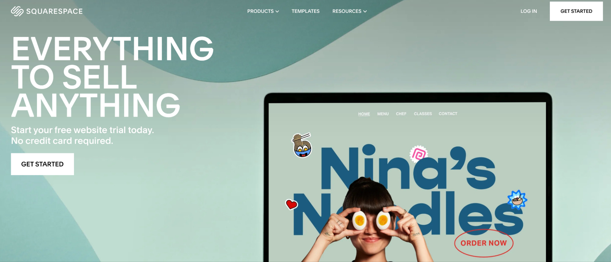 Ecommerce platform homepage with a laptop screen showing a sample store design for a restaurant.